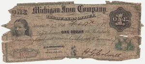 A worn, 19th-century paper note for one dollar issued by the Michigan Iron Company, featuring a portrait of a young girl on the left and frayed, torn edges.