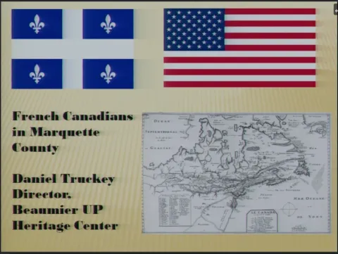 Symposium slide titled 'French Canadians in Marquette County' featuring the Quebec and US flags beside an early map.